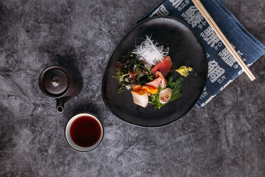 Tasty Sashimi on plate on table