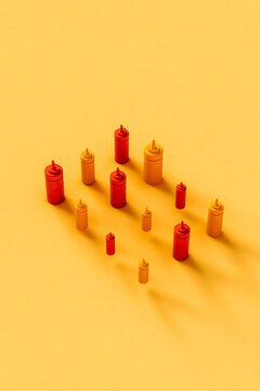 vertical image of some Sauce dispencer on yellow background