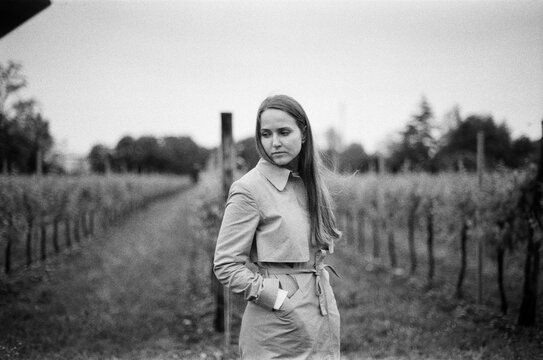 Pensive woman in a vineyard
