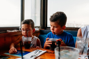 Kids picking food from a menu. 