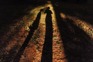 Silhouette of two people.