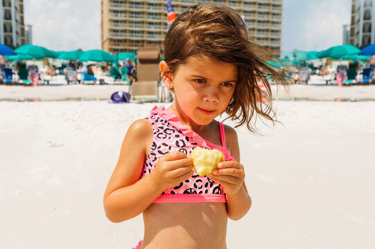 Child enjoying an apple for a snack. 