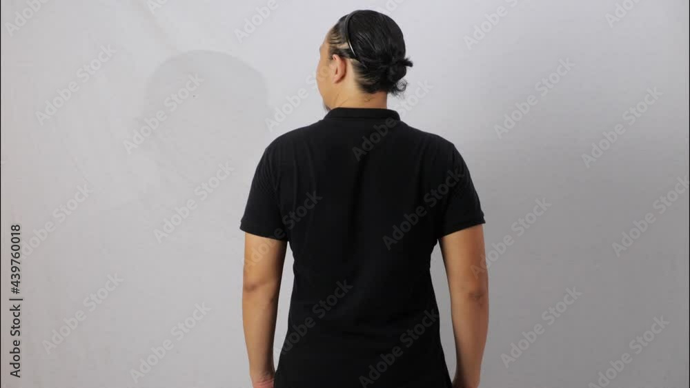 Wall mural Blank collared shirt mock up template, rear back view, Asian male model wearing plain black t-shirt isolated on white. Polo tee design mockup presentation