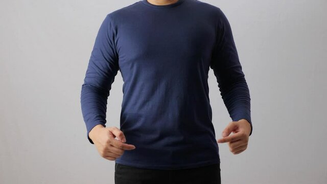 Blank long sleeved shirt mock up template, front view, Asian man wear plain dark navy blue t-shirt isolated on white. Tee design mockup presentation