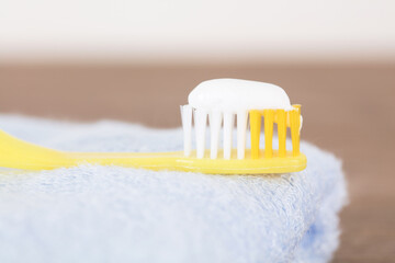 Toothbrush with toothpaste squeezed on the towel