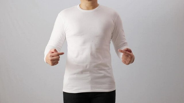 Blank long sleeved shirt mock up template, front view, Asian man wear plain white t-shirt isolated on white. Tee design mockup presentation