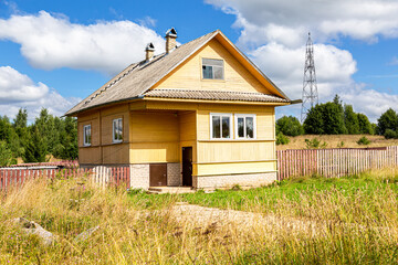 Rural wooden house in russian village in summer day