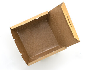 Opened eco takeaway food box on white background. Empty brown paper food box with waterproof coating inside. Top view image.