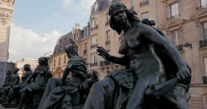 paris six continents statue