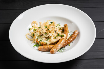 potato pancakes with sausages and fried onion