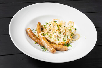 potato pancakes with sausages and fried onion