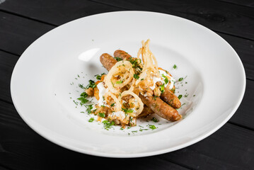 potato pancakes with sausages and fried onion