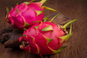 red dragon fruit on old wooden table background