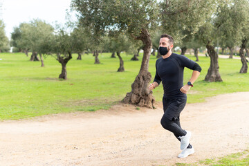 Runner with mask training in a park