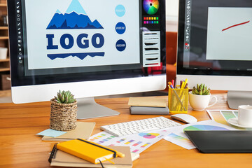 Comfortable workplace of graphic designer in office