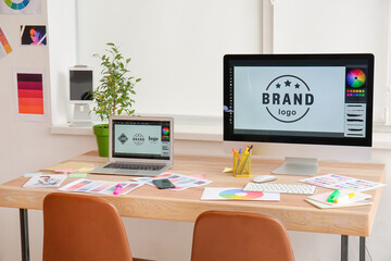 Comfortable workplace of graphic designer in office