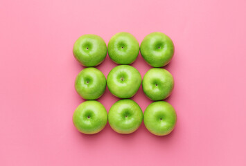 Fresh green apples on color background