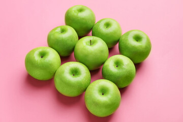 Fresh green apples on color background