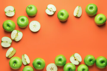 Fresh green apples with pieces on color background