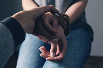 young woman's hands are tied