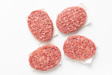  Raw minced homemade cutlets, on the white background