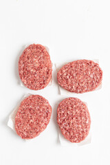  Raw minced homemade cutlets, on the white background