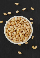 pine nuts on dark background