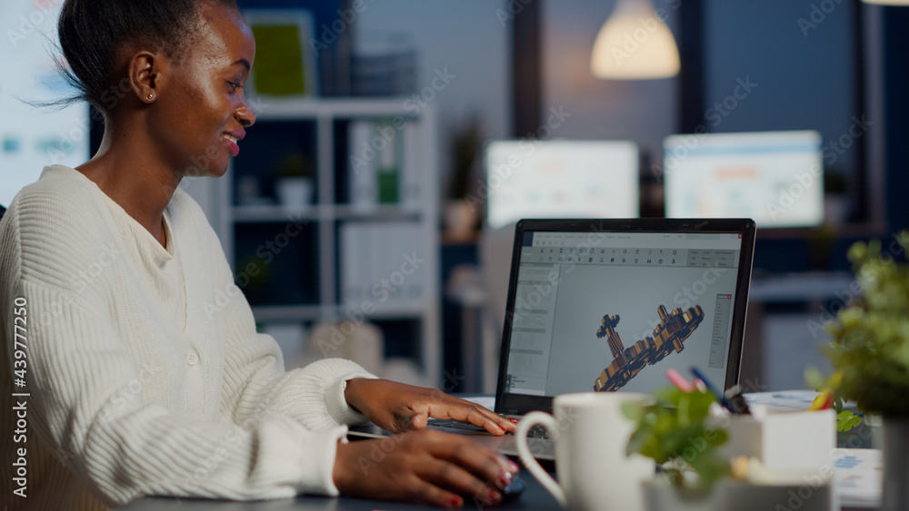 Poster black woman architect working in modern cad program overtime sitting at desk in start-up business of