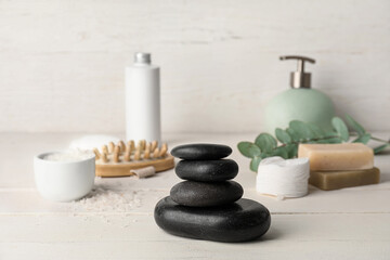 Stack of spa stones on wooden table
