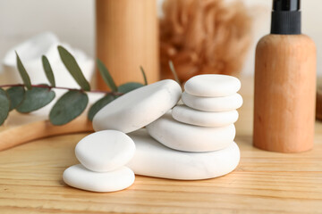 Stack of spa stones on wooden table