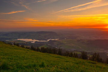 Naklejka na ściany i meble Sunset over the Swiss Alpes, shot from the 