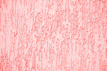 Concrete coral wall background on the street.