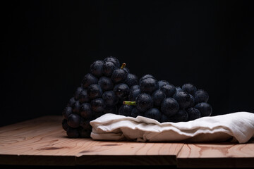 large grapes on a cloth on a black background.
A variety called Nagano Purple