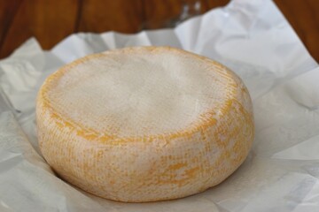 Reblochon is a soft washed-rind and smear-ripened French cheese made in the Alpine region of Savoie from raw cow's milk. It has its own AOC designation.