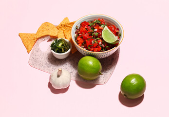 Bowl of tasty Pico de Gallo salsa and nachos on color background