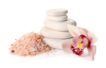 Spa stones with beautiful orchid flower and sea salt on white background