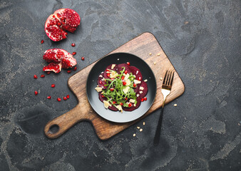 Composition with delicious beetroot carpaccio on dark background