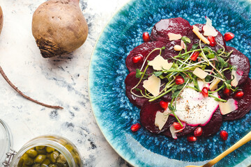 Composition with delicious beetroot carpaccio on grunge background