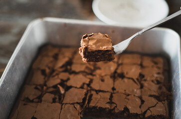 Best brownies dessert in a cake pan. High angle view of freshly baked brownies. Delicious chocolate cake.