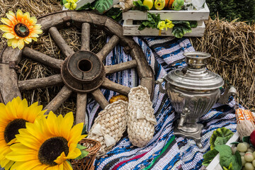 Rustic still life with bast shoes and samovar