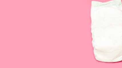 Baby diapers on pink background. Space for text