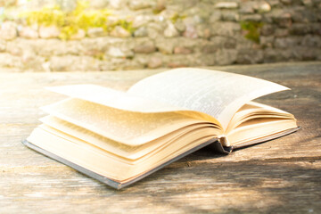 old open book on a wooden table. The concept of education