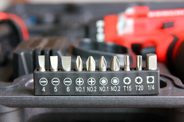 close up screwdriver head set in eletric drill diy box set