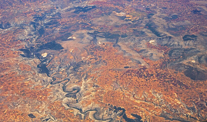 mountain landscape view from the airplane window, top view. horizontal.