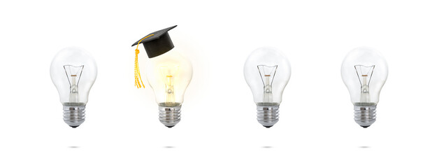 concept out of the box. a graduate's cap on a light bulb that glows. concept of education and idea