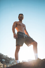 Fototapeta premium Shirtless guy and shorts is resting after the run