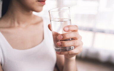 Beautiful girls drink water for good health, such as helping to digest food. Makes the heart work...