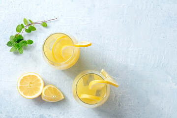 Lemonade. Homemade fresh drink with lemon and mint, with ice, overhead flat lay shot with copy...