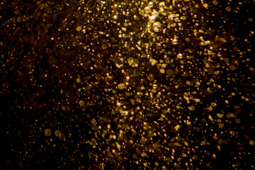 Gold bokeh blur defocus with black background