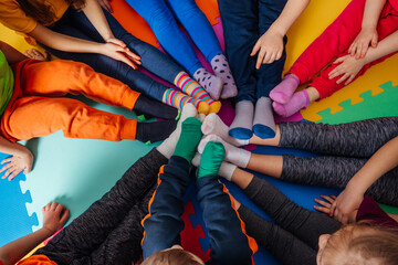 Top view circle of young kids in colorful clothes - 439795229